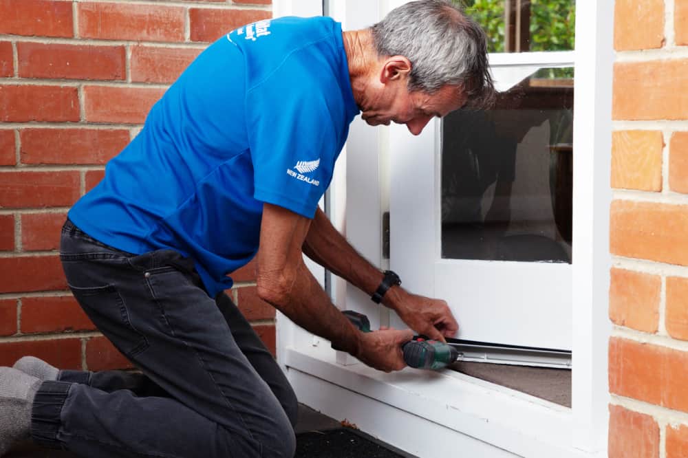 John repairing the entry door